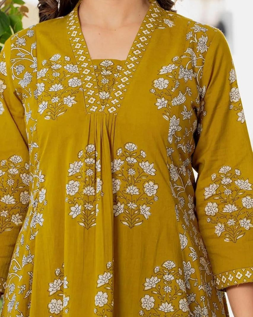 Yellow dress with floral patterns on a blurred background