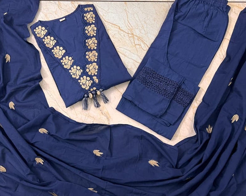 Navy blue fabric with gold embroidery on a light brown surface